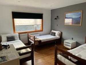 Voodi või voodid majutusasutuse Pristine Patagonia Hotel toas