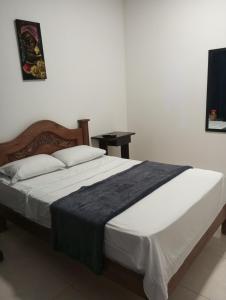 Voodi või voodid majutusasutuse Hotel Palmari toas