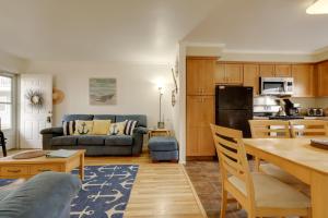 a kitchen and living room with a couch and a table at Bay Access The English Condo in Ocean City in Ocean City