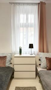 Łóżko lub łóżka w pokoju w obiekcie Beautiful Rooms - Wały Chrobrego
