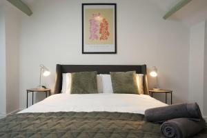 a bedroom with a large bed with two side tables at Modern 2 Bed Apartment in Hillsborough with FREE Secure Parking - Hosted by Stay Host Save in Hillsborough