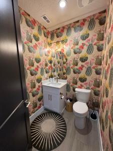 a bathroom with a toilet and a sink at Wild West Oasis - Experienced Hosts, 2 King Suites in Hurricane