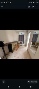 a room with a table and chairs in a room at Alojamiento Artigas in Artigas