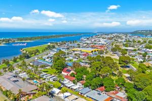 an aerial view of a town next to the water at Waters Edge Holiday Park in Lakes Entrance
