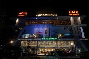 a building with a car parked in front of it at Townhouse Somani TC in Pune