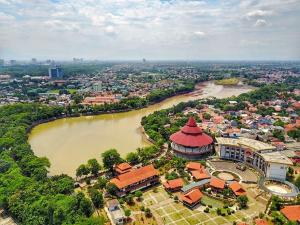 an aerial view of a building next to a river at PM Room in Jakarta