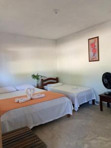 Postel nebo postele na pokoji v ubytování Suites noach beach