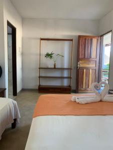 Postel nebo postele na pokoji v ubytování Suites noach beach