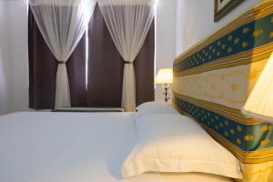 Ένα ή περισσότερα κρεβάτια σε δωμάτιο στο Casa kretcheu Mindelo