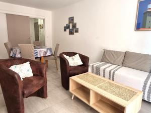 a living room with a couch and two chairs at Port-Vendres - Appartement F3 avec parking et WIFI - FR-1-309-241 in Port-Vendres