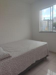 Ένα ή περισσότερα κρεβάτια σε δωμάτιο στο Apartamento mobiliado