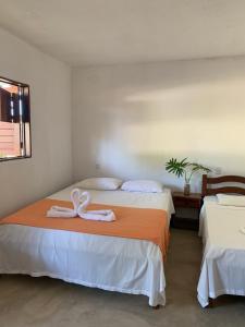 Postel nebo postele na pokoji v ubytování Suites noach beach