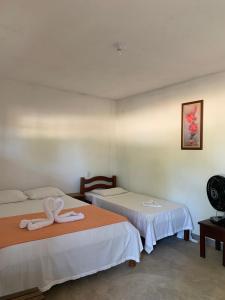 Postel nebo postele na pokoji v ubytování Suites noach beach