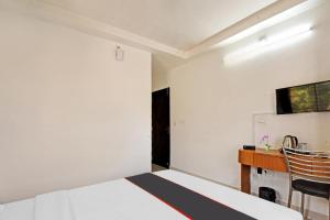 Super Collection O Mountain View Resort客房内的一张或多张床位