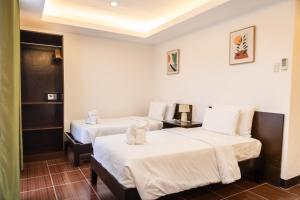 Letto o letti in una camera di Palmbeach Resort & Spa Mactan, Cebu