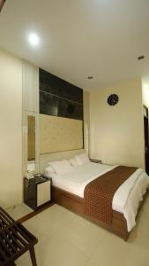 Katil atau katil-katil dalam bilik di griya desa hotel & pool