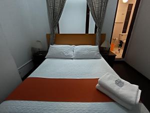 Postel nebo postele na pokoji v ubytování Hotel del Parque Confort LaCeja
