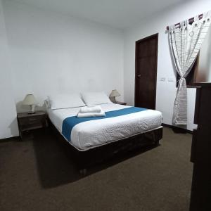 Postel nebo postele na pokoji v ubytování Hotel del Parque Confort LaCeja