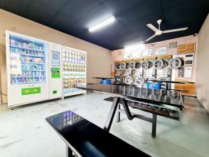 a laundry room with a table and a washer and dryer at Casa SS16 Subang Jaya SJMC Nu Empire Sunway Pyramid Lagoon Sunway Hospital LRT KTM in Subang Jaya