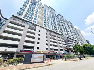 a large white building on a street with two tall buildings at Casa SS16 Subang Jaya SJMC Nu Empire Sunway Pyramid Lagoon Sunway Hospital LRT KTM in Subang Jaya