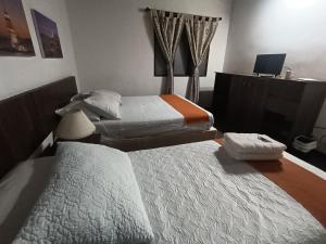 Postel nebo postele na pokoji v ubytování Hotel del Parque Confort LaCeja