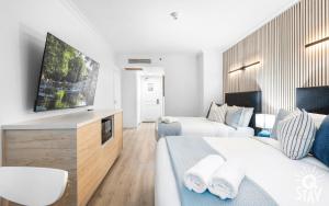 Legends Apartments - QStay電視和／或娛樂中心 +84 張相片