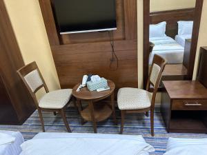 Postel nebo postele na pokoji v ubytování فندق نجمة ذاخر توصيل مجاني للحرم - Zakher Star Hotel Free Shuttle Service
