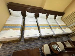 Postel nebo postele na pokoji v ubytování فندق نجمة ذاخر توصيل مجاني للحرم - Zakher Star Hotel Free Shuttle Service
