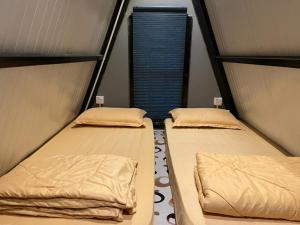 Postel nebo postele na pokoji v ubytování Amar Camp Taman Negara Kuala Tahan
