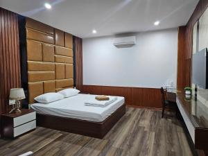 Postelja oz. postelje v sobi nastanitve Nhà Nghỉ Ruby Hotel - KĐT Dương Nội Geleximco