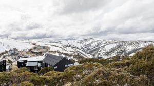 a house on top of a snowy mountain at Whitemount in Mount Hotham