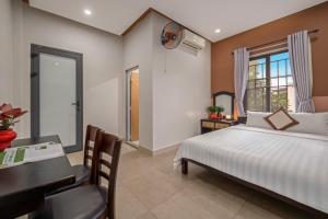 Postel nebo postele na pokoji v ubytování Bo Bo Homestay Hoi An + 19 fotografií