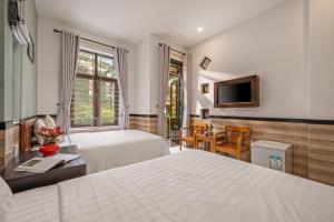 Postel nebo postele na pokoji v ubytování Bo Bo Homestay Hoi An