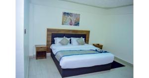 Postel nebo postele na pokoji v ubytování Waffle Suites