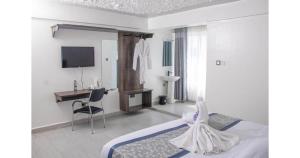 TV a/nebo společenská místnost v ubytování Waffle Suites