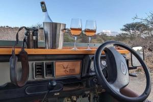 two glasses of wine and a steering wheel at RetoSafarisMara in Masai Mara