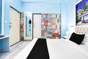 Postel nebo postele na pokoji v ubytování Super Hotel O Vaishali Nagar