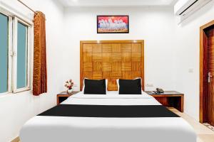 Postel nebo postele na pokoji v ubytování Super Townhouse Arakashan Road Paharganj formerly Mohan international