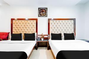 Postel nebo postele na pokoji v ubytování Super Townhouse Arakashan Road Paharganj formerly Mohan international