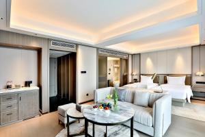 Postel nebo postele na pokoji v ubytování 银都酒店 Yandoo Hotel