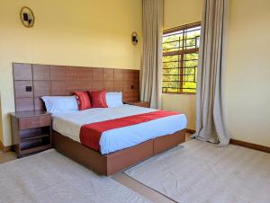 Postel nebo postele na pokoji v ubytování Hillsgate Experience a Luxury Home in Nairobi
