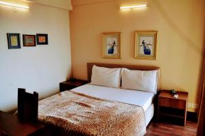 Katil atau katil-katil dalam bilik di Studio Apartment with Green Lawn +44 gambar