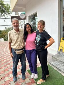 a man and two women standing next to each other at GreenDay Escapes Rishikesh in Rishīkesh