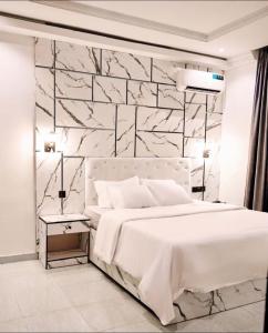 Voodi või voodid majutusasutuse York V Hotel And Suite toas