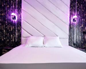 Voodi või voodid majutusasutuse York V Hotel And Suite toas