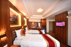 Letto o letti in una camera di Hotel Friends Home