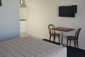 TV a/nebo společenská místnost v ubytování 319 Addington Motel