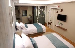 Katil atau katil-katil dalam bilik di Sojourn Guest House