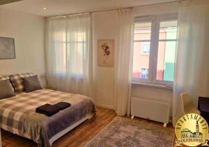 Posteľ alebo postele v izbe v ubytovaní Apartamenty Bolesławiec Prusa