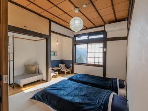 Postel nebo postele na pokoji v ubytování Guesthouse Nedoko